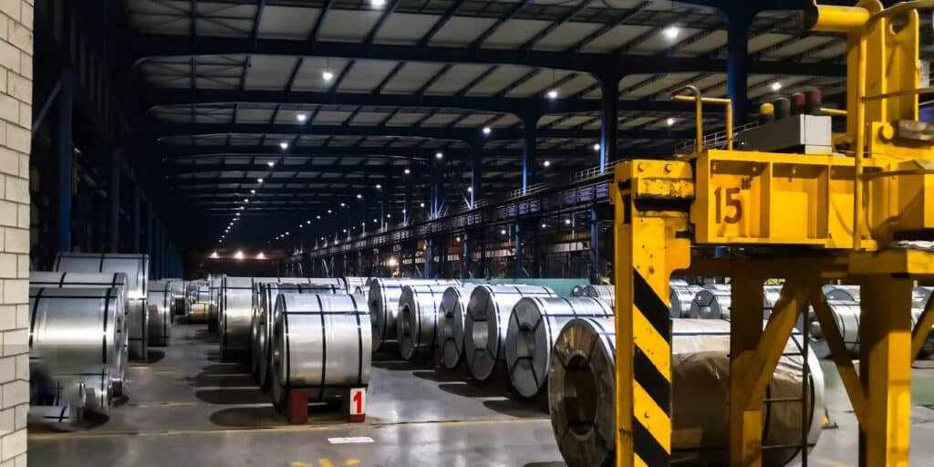 Steel manufacturing line, large steel rolls being processed