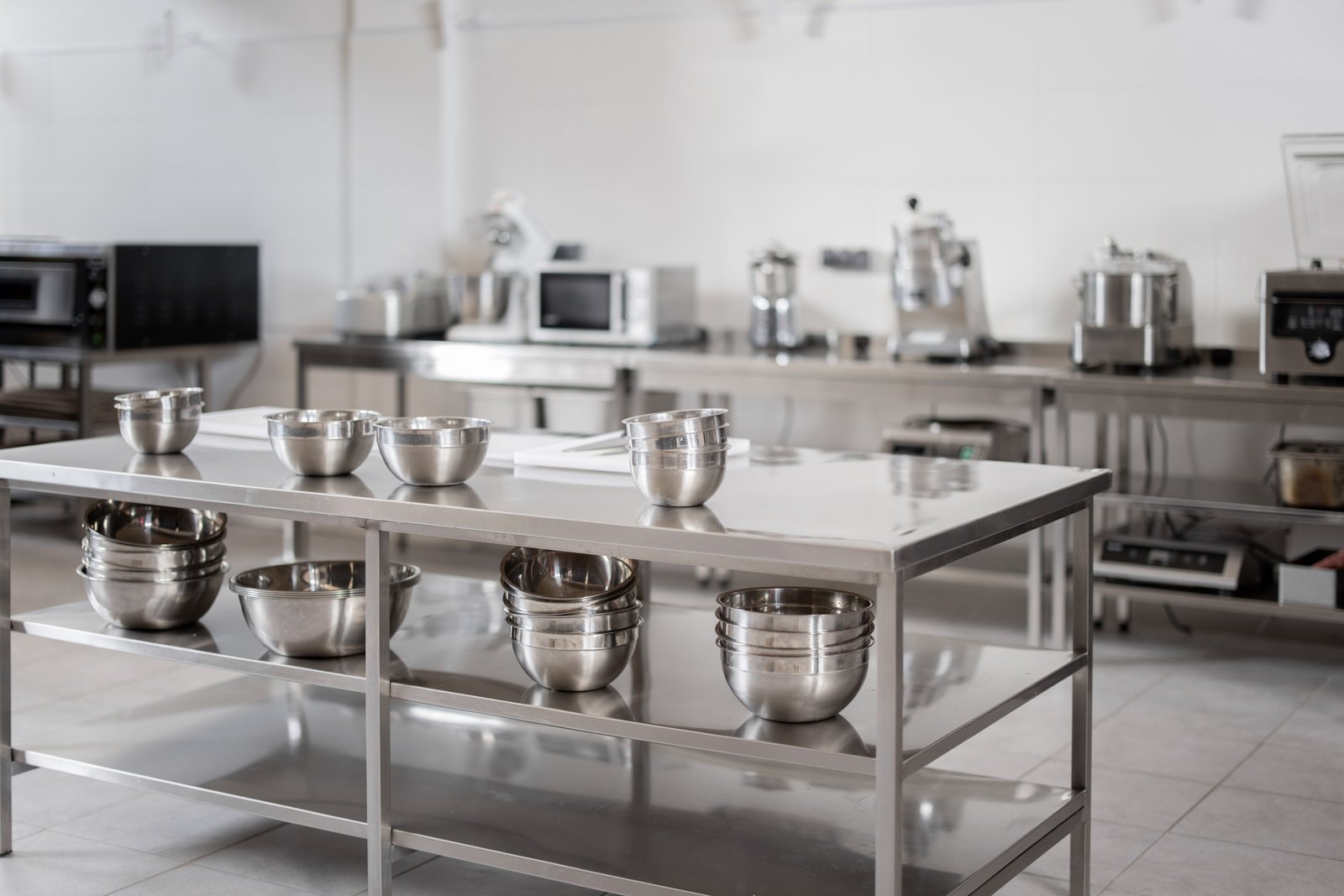 Dental surgical stainless steel tools laid out in a sterilization tray, ready for medical procedures.