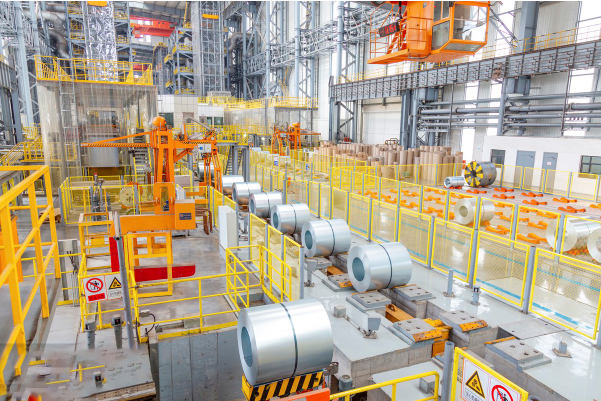 Stainless steel coil production line with operator managing heavy-duty rolling machine inside MFY workshop