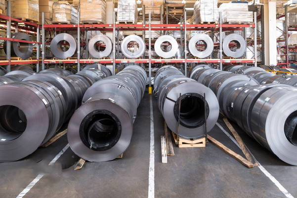 Cold rolled stainless steel coils with blue wrapping in factory warehouse, ready for export