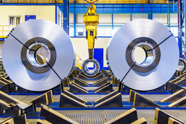 Industrial coil tower system in stainless steel processing plant, representing modern metallurgy equipment