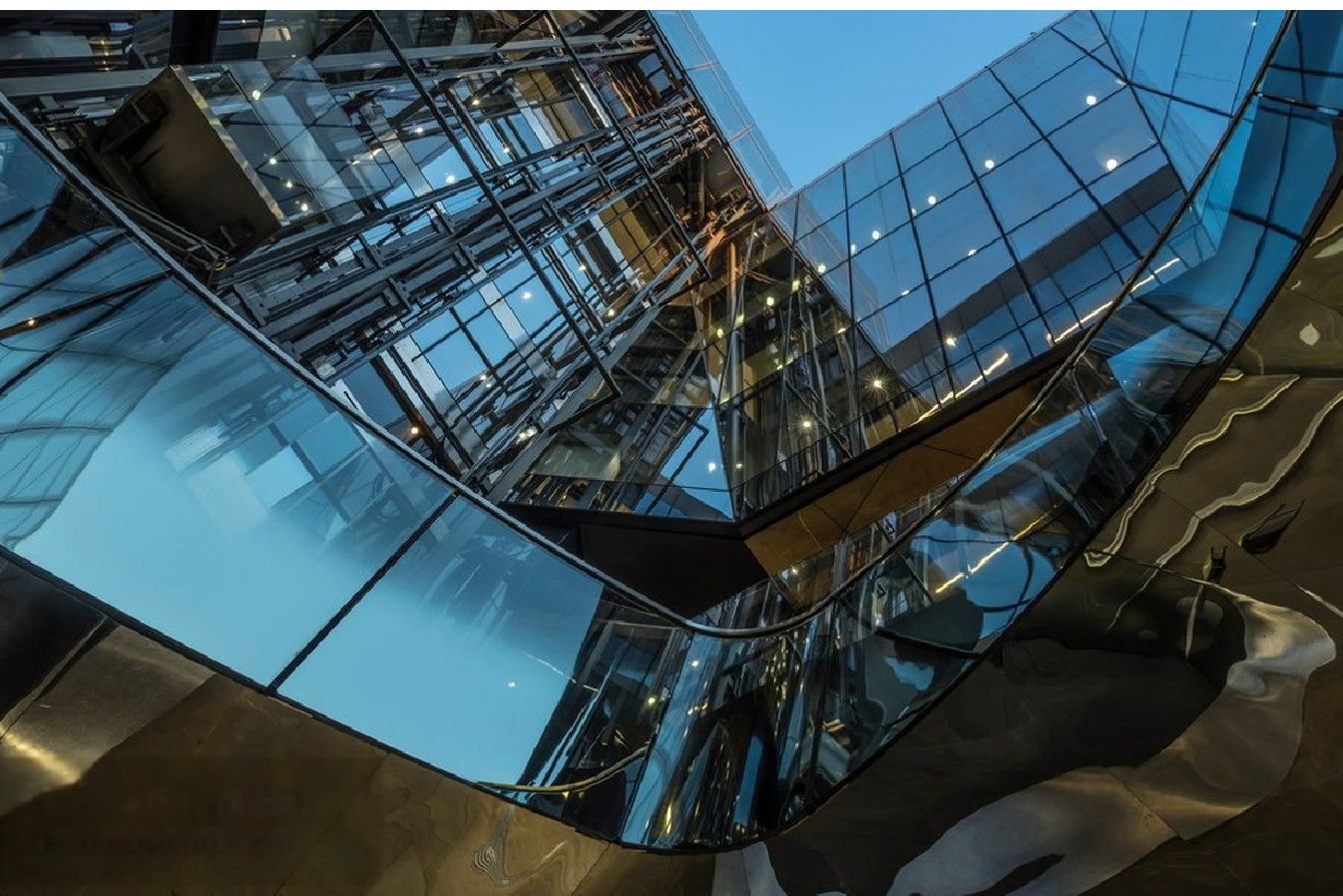 Futuristic glass and steel building showing structural usage of MFY stainless steel coils and tubes