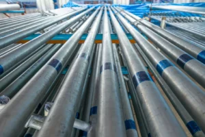 Close-up view of durable stainless steel pipes arranged in a manufacturing facility, showcasing MFY's precision engineering.
