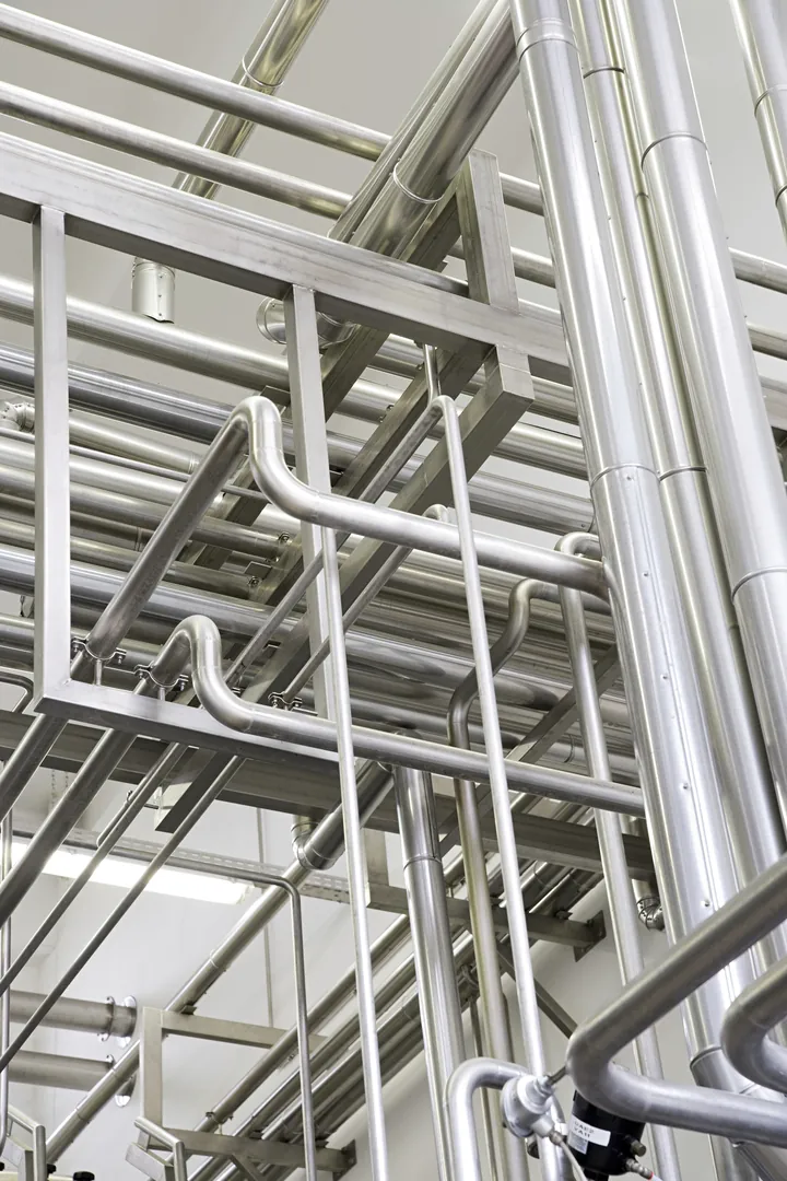 Close-up view of stainless steel pipes used in industrial applications and manufacturing processes.