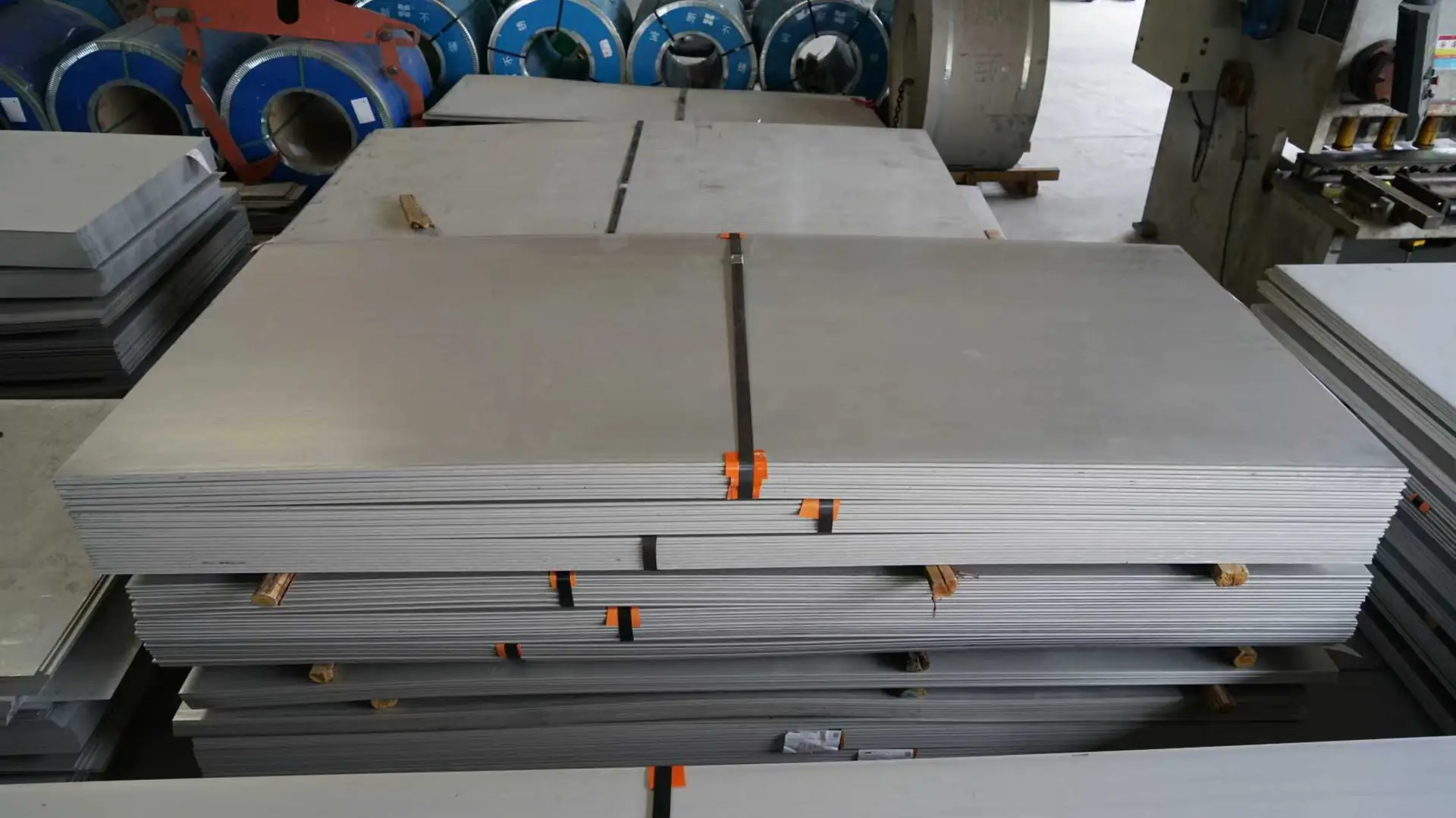 Stacked stainless steel sheets in warehouse ready for distribution